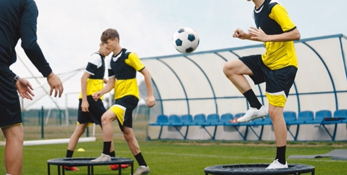 Soccer players improving fitness and agility soccer skills