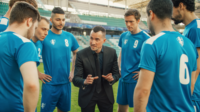 Coach talking to his youth squad, doing team talk!