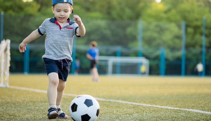 4 year old kid playing soccer